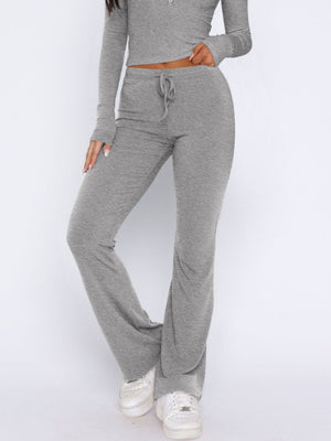 Gray ribbed loungewear pants with drawstring waist and flared leg