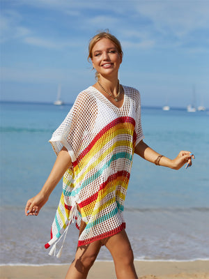 Rainbow stripe crochet beach poncho with V-neck and tassel ties.