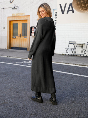 Longline knit collar cardigan in black acrylic with a ribbed texture and full-length sleeves.
