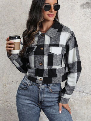 Checked plaid shacket in black and white with patch pockets and button front.