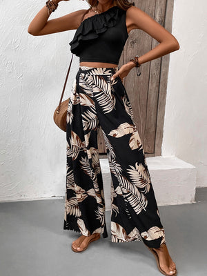 Black asymmetrical ruffle crop top with wide-leg palm print pants