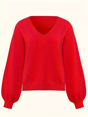 Red v-neck knit sweater with balloon sleeves and ribbed cuffs.