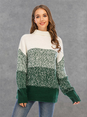 Colorblock knit turtleneck sweater in green and white with defined panels and ribbed cuffs.