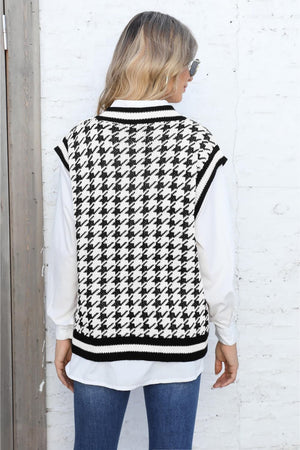 Houndstooth knit vest with V-neck and striped trim, layered over a white shirt.