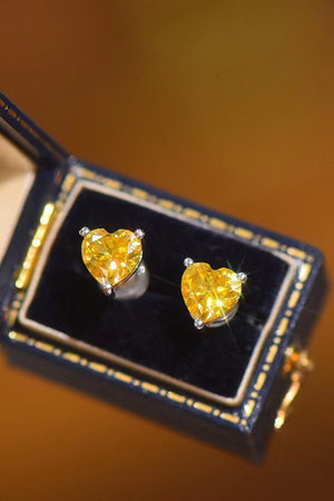 Yellow heart moissanite stud earrings in a jewelry box