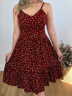 Charming floral print ruffle hem midi dress with spaghetti straps and a V-neckline.