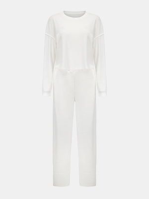 White waffle knit cropped lounge set with long sleeves and wide-leg pants.