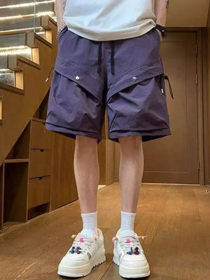 Mauve lightweight cargo shorts with drawstring and flap pockets, worn by a man.