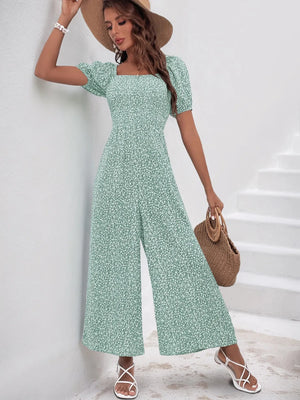 Light green floral print jumpsuit with smocked bodice and wide legs.