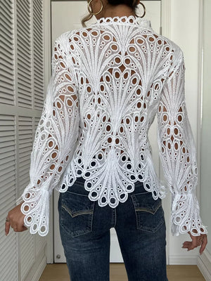 White lace button-up blouse with scalloped collar and bell sleeves, intricate cutout pattern.