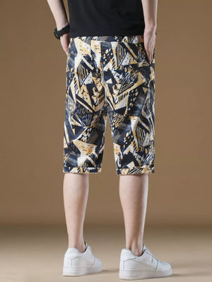 Men's abstract geometric print drawstring chino shorts with cuffed hem.