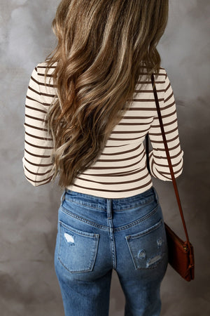 Ribbed stripe henley top in cream with brown stripes, long sleeves, and a casual fit.