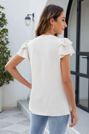 Beige blouse with pleated yoke and flutter sleeves, casual short sleeve top.