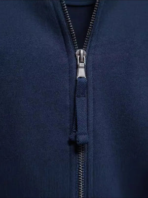 Navy track jacket with full zip and chevron pull tab detail.