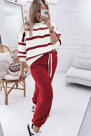 Loungewear set with red and white striped top and red sweatpants with drawstring.