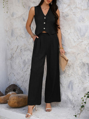 Black textured crop vest and wide leg pants set with button detail.