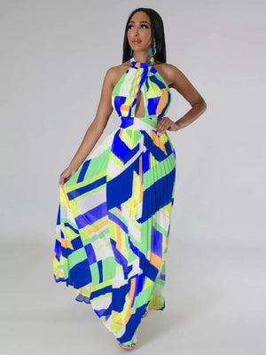 Halter neck maxi dress with geometric print, cutout, and pleated skirt.