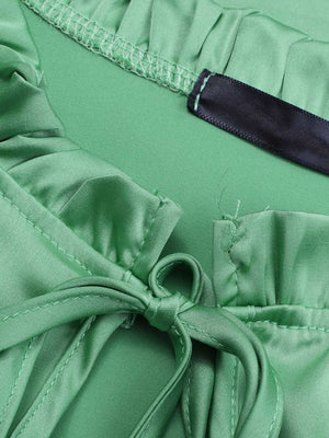 Gum Leaf green satin blouse with tie neck and shirred cuffs detail