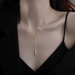 Gold Y-shaped pendant necklace in sterling silver with a delicate drop detail.