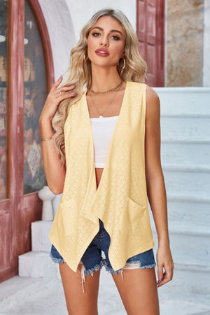 Yellow eyelet drape front vest with pockets and a waterfall hem.