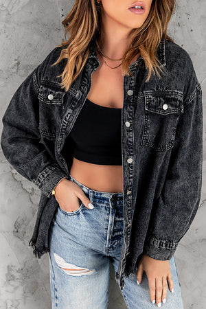Oversized black denim shirt jacket with frayed hem and button front.