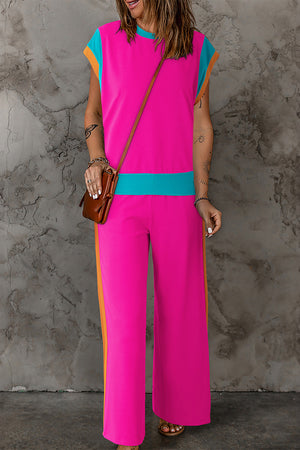Colorblock sportswear set with contrast trim in hot pink, aqua, and orange.