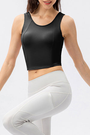 Black active crop top with sculpted seams and scoop neckline.