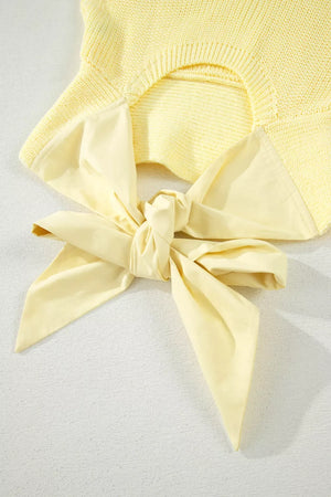Yellow knit sweater vest with cutout back and tie detail