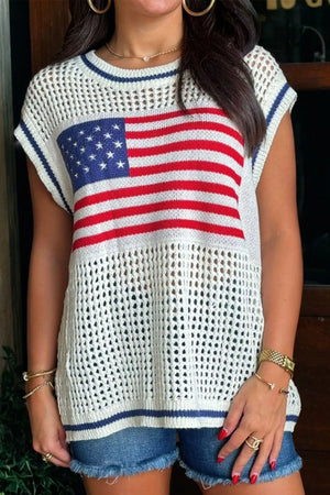 Patriotic eyelet knit sweater with cap sleeves and American flag detail.