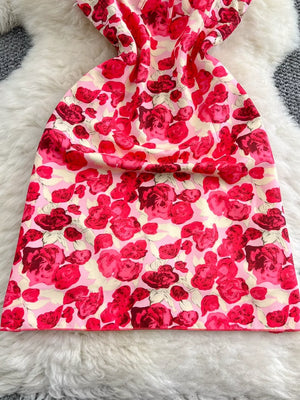 Charming floral ruffle trim mini dress with a pink and red rose print