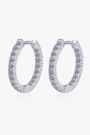 Silver pavé crystal huggie hoop earrings with a polished finish.