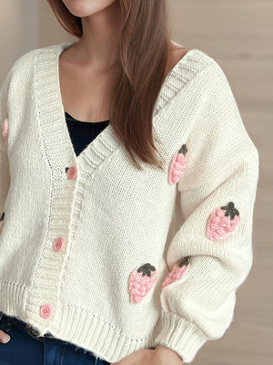Cream knit cardigan with pink strawberry appliqué and buttons