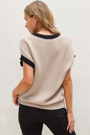 Beige knit cap sleeve top with black trim detail