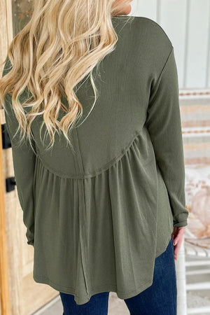 Moss ribbed peplum yoke blouse with long sleeves and a gathered hem.