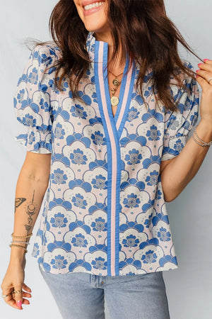 Playful floral puff sleeve blouse with V-neck and frill detail in blue and pink polyester.