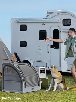 Gray travel-friendly pet carrier with mesh ventilation and zippered pockets, shown outdoors.