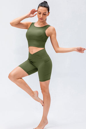 Cross-waist active bike shorts in Matcha Green with pockets.