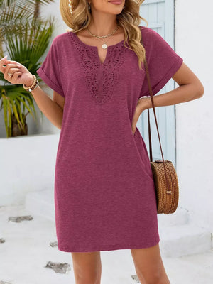 Deep purple V-neck dress with lace inset detail and short sleeves.