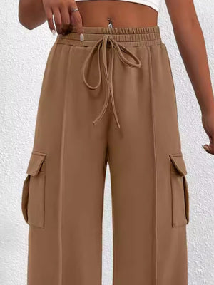 Khaki high waist cargo pants with drawstring and side pockets.