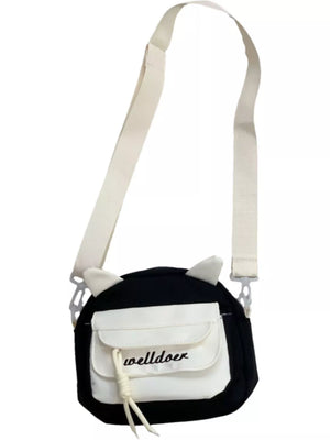 Black crossbody bag with white accents, cat ears, and adjustable strap.