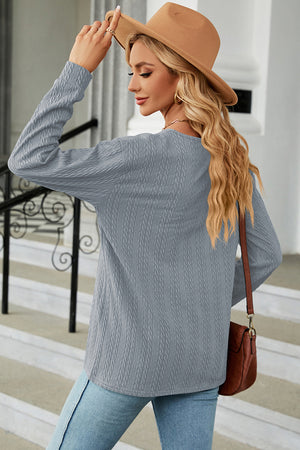 Light Blue textured cable-knit henley pullover with long sleeves and a crew neck.