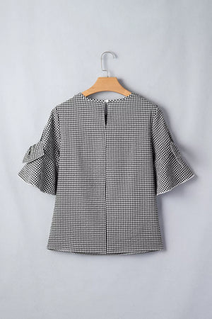 Black and white gingham polyester shirt with ruffled sleeves and a keyhole back detail.