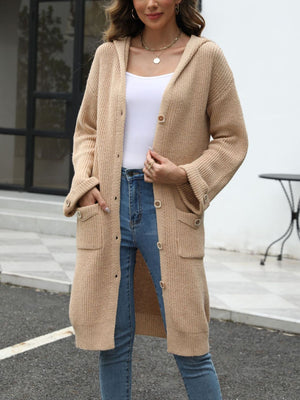 Longline tan knit cardigan with hood, buttons, and pockets.