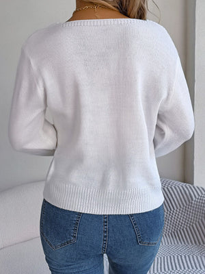 White cable knit sweater with square neckline and ribbed hem.