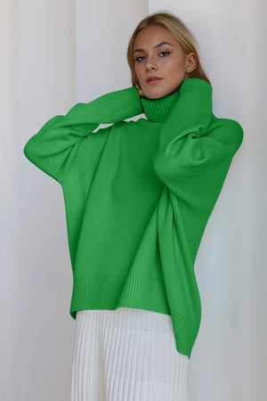 Green oversized cashmere turtleneck sweater with ribbed cuffs and hem.