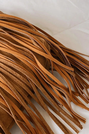 Bohemian suede fringe crescent bag in caramel with detailed fringe.