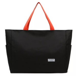 Black canvas shoulder bag with orange straps and side pockets.