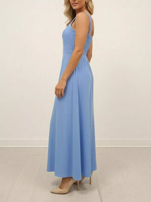 Blue maxi dress with wide straps and smocked back detail.