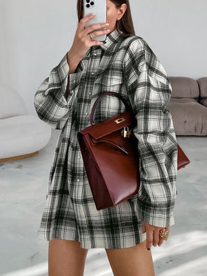 Button-up long sleeve cotton shirt dress in black and white plaid with pearl details.