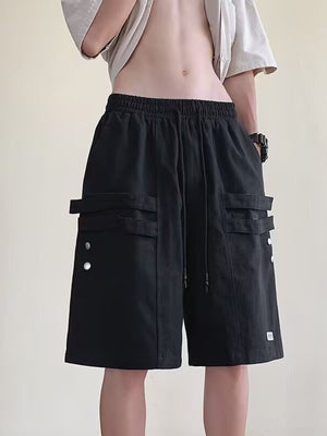 Men's black cargo shorts with drawstring and buttoned flap pockets.